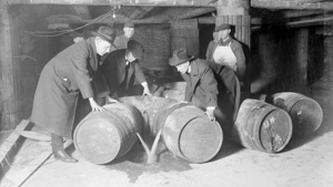Prohibition agents destroying barrels of alcohol